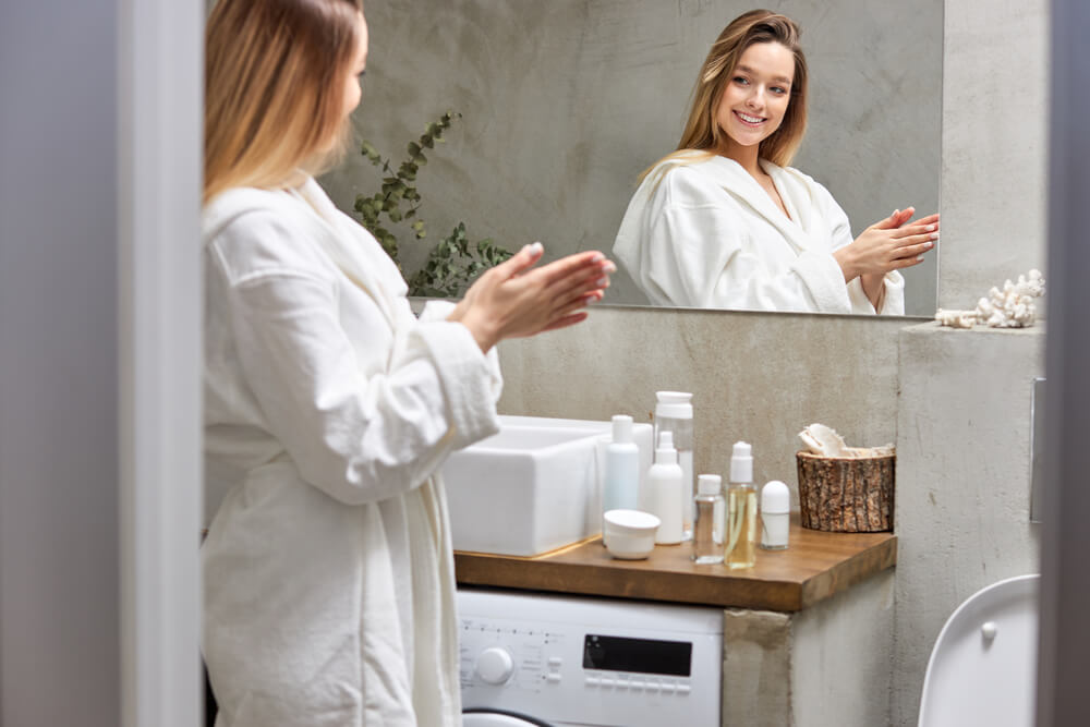 Woman following daily skincare routine