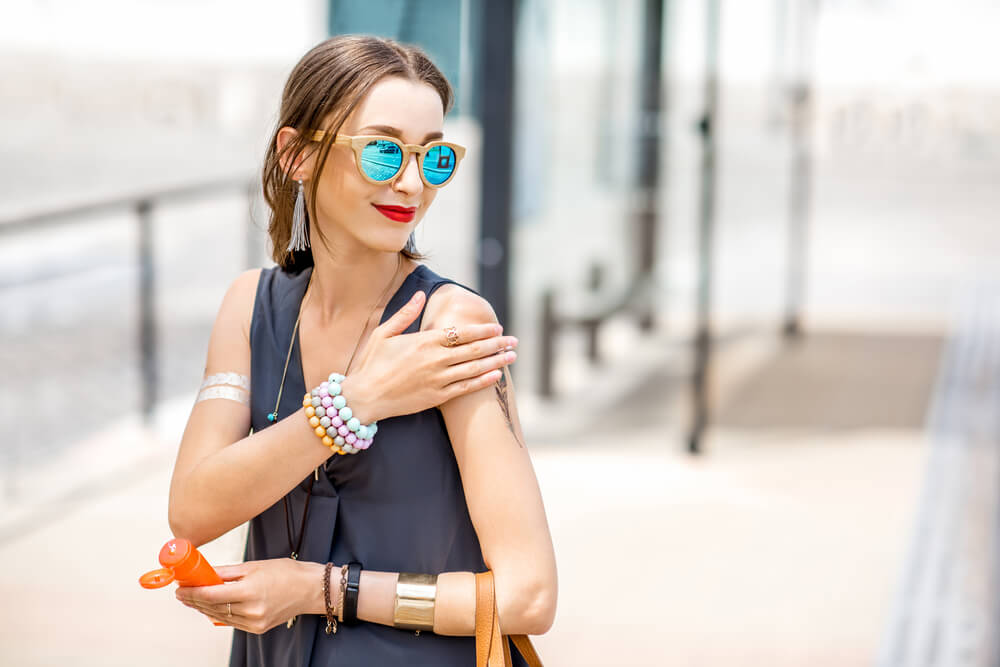 Woman applying SPF