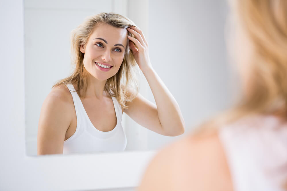 Woman looking at hair