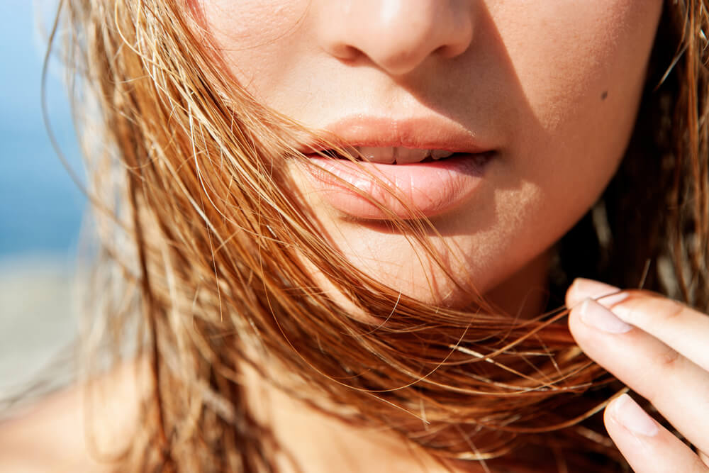 Woman holding hair