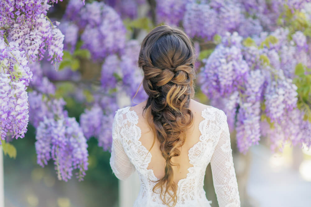 Woman using braids to style thick hair