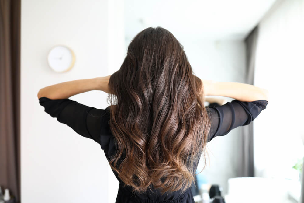 Woman with wavy thick hair